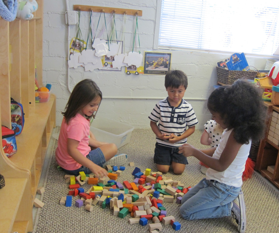 Children in class playing building blocks