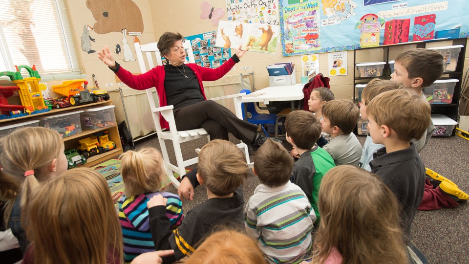 Sandy Lyons reads to VPK students at Trinity Learning Center daycare