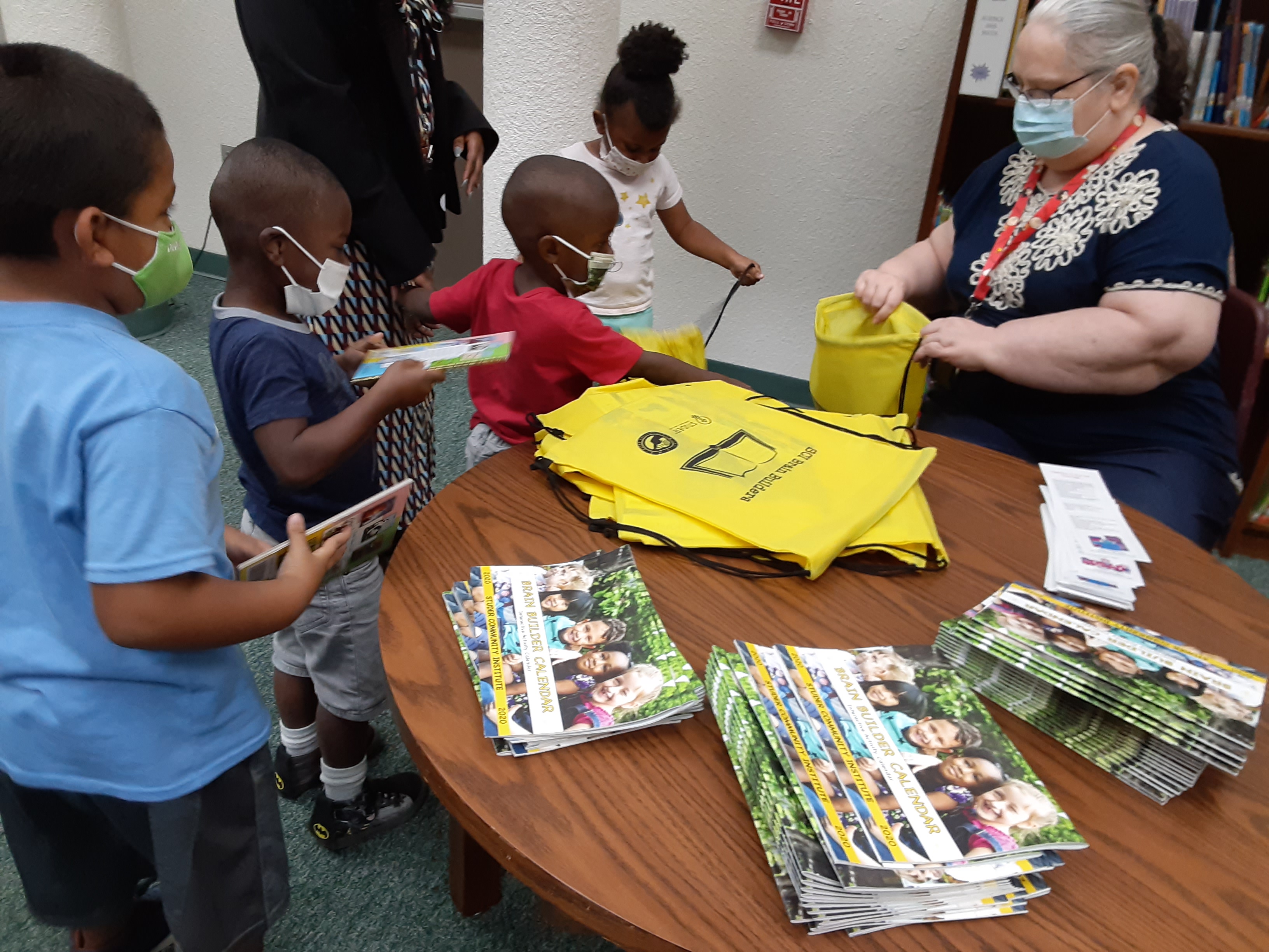 Lincoln Park students receiving book bags