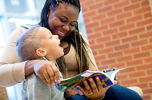 picture of a woman reading to a child