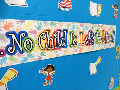 Classroom bulletin board with No Child is Left Behind banner