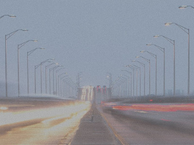 Blurred image of vehicles crossing a bridge